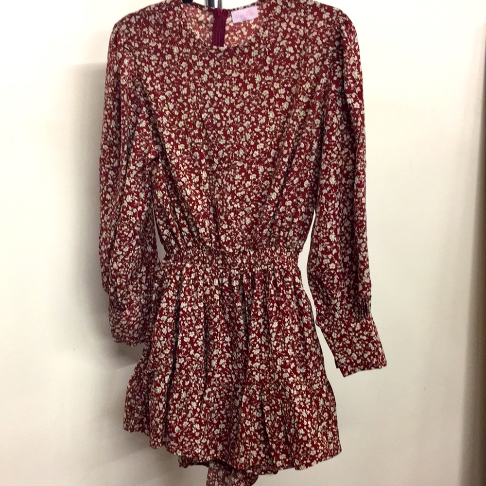 Women’s size small Pink Lily floral romper. Like new